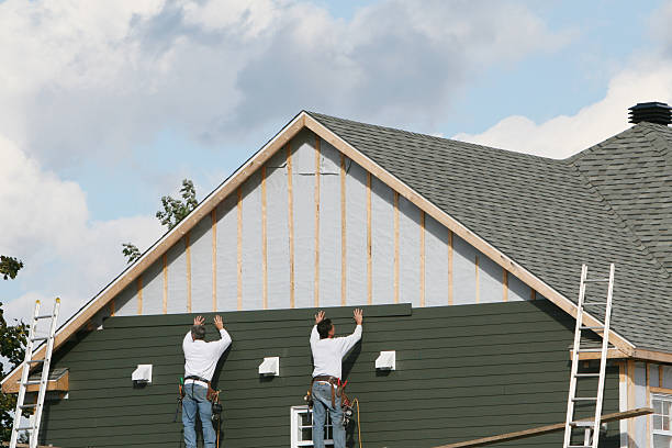 Professional Siding technician working in Locust Valley, NY